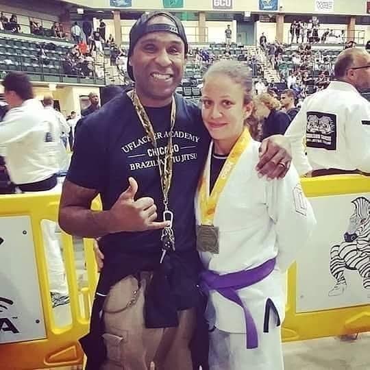 Gideon Ray congratulating a medal-winning student at a Brazilian Jiu Jitsu tournament.